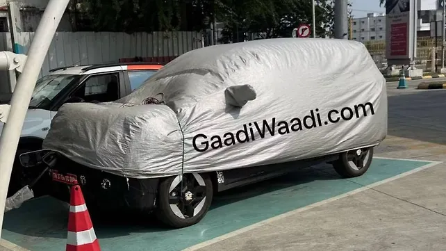 Kia Carens EV Spotted Charging: Reveals ADAS Sensors Kia Carens EV Spotted Charging: Reveals ADAS Sensors